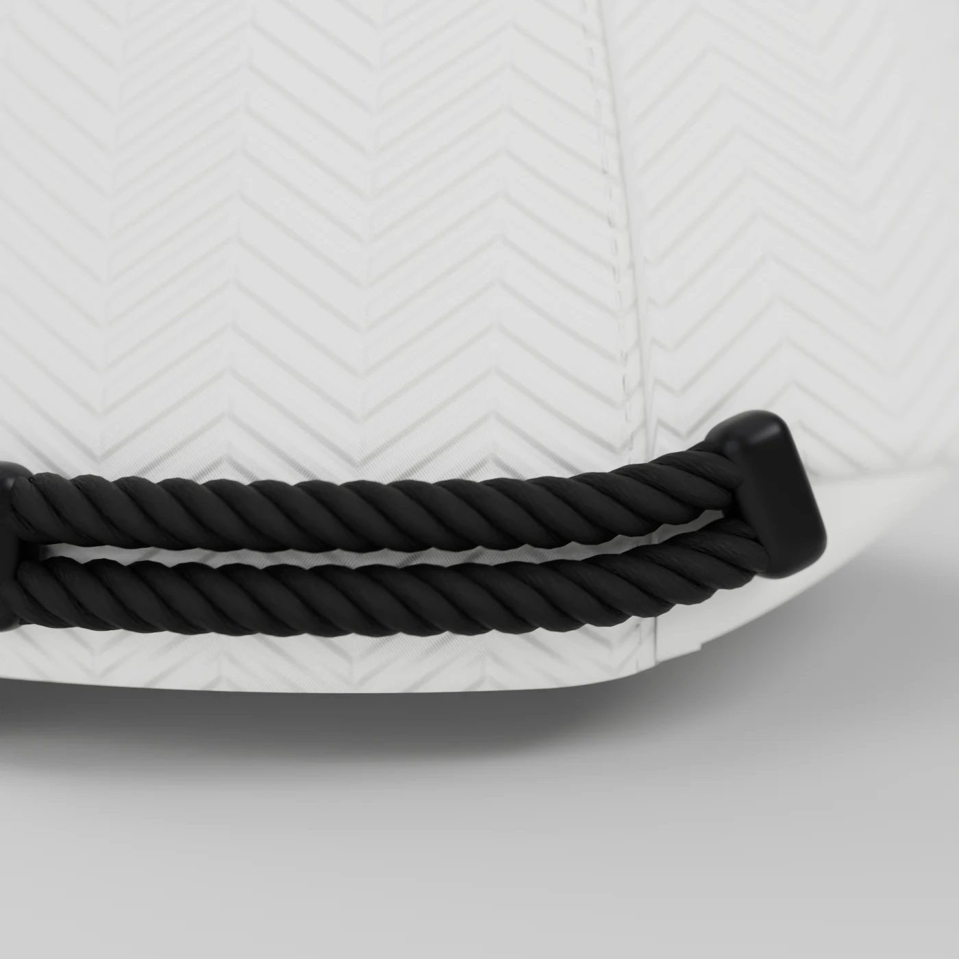Macro view of the two black braided agal cords held by a matte black end holder